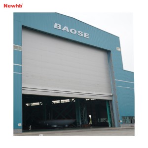 Vertical lifting fabric door