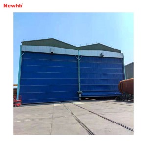 Vertical lifting fabric door